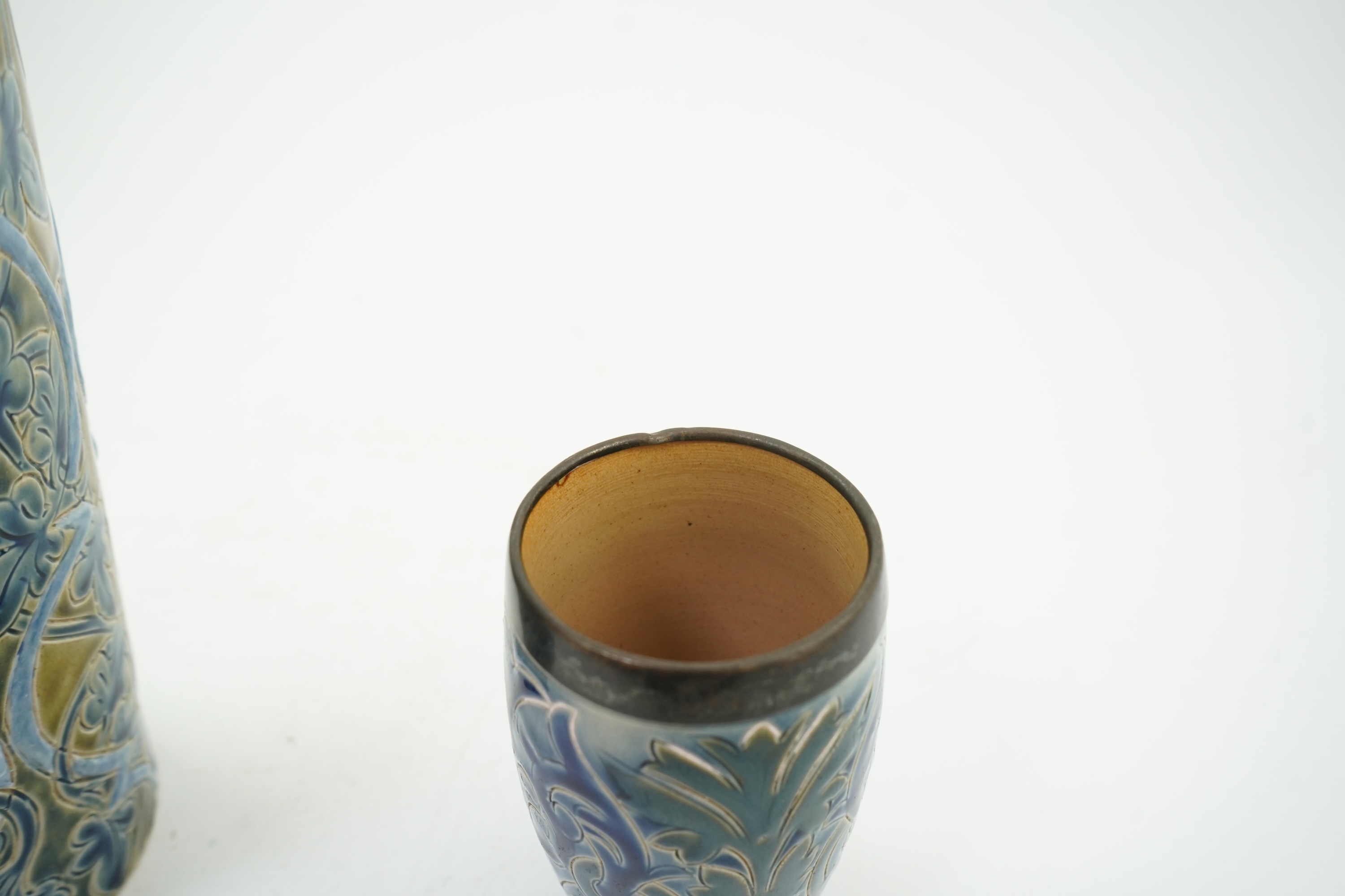 A Doulton Edith Lupton stoneware vase, drill hole to base, together with a similar Martha Rogers silver mounted cup, Tallest 31cm